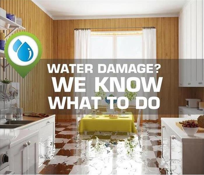 Kitchen with water damage and the words “water damage?  We know what to do”